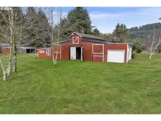 a open kitchen with kitchen island granite countertop a stove and a wooden floors