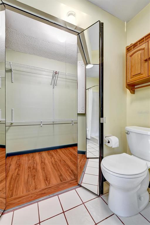 558 Capistrano Court Largo, FL 33771 - Photo 20 of 40 a bathroom with a toilet and a shower