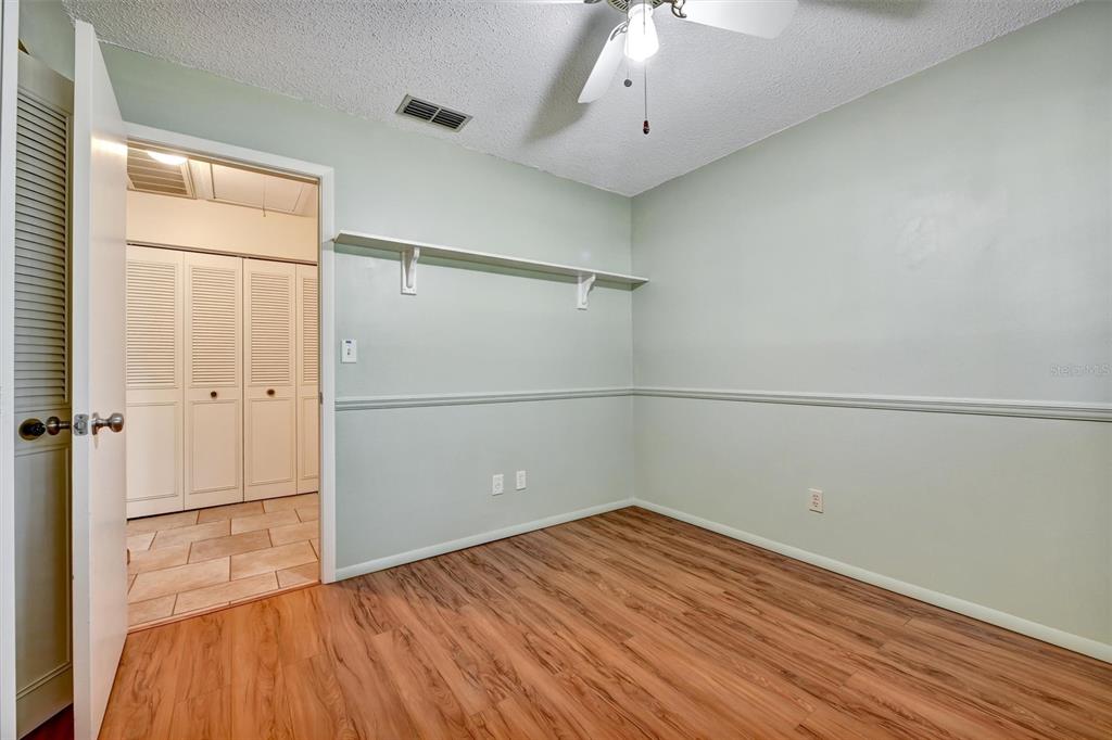 558 Capistrano Court Largo, FL 33771 - Photo 23 of 40 a view of a room with wooden floor