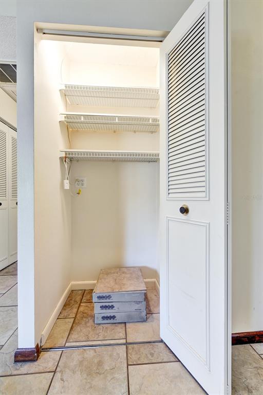 558 Capistrano Court Largo, FL 33771 - Photo 26 of 40 a room with windows and a table