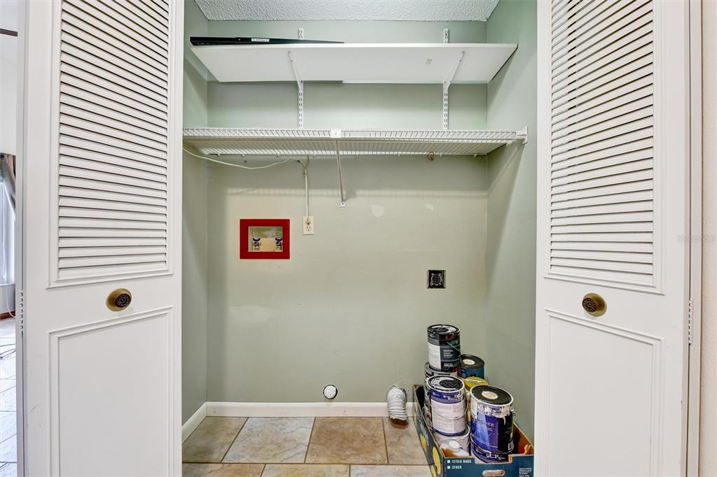 558 Capistrano Court Largo, FL 33771 - Photo 28 of 40 a room with a door and a window