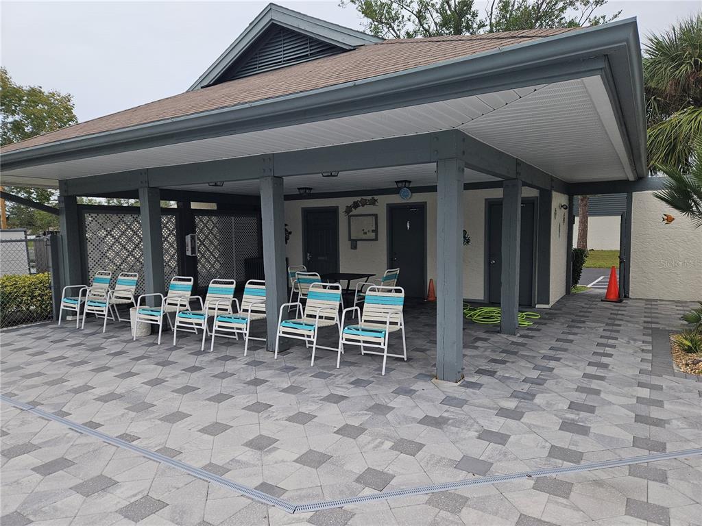558 Capistrano Court Largo, FL 33771 - Photo 39 of 40 a view of a chairs and table in patio of the house