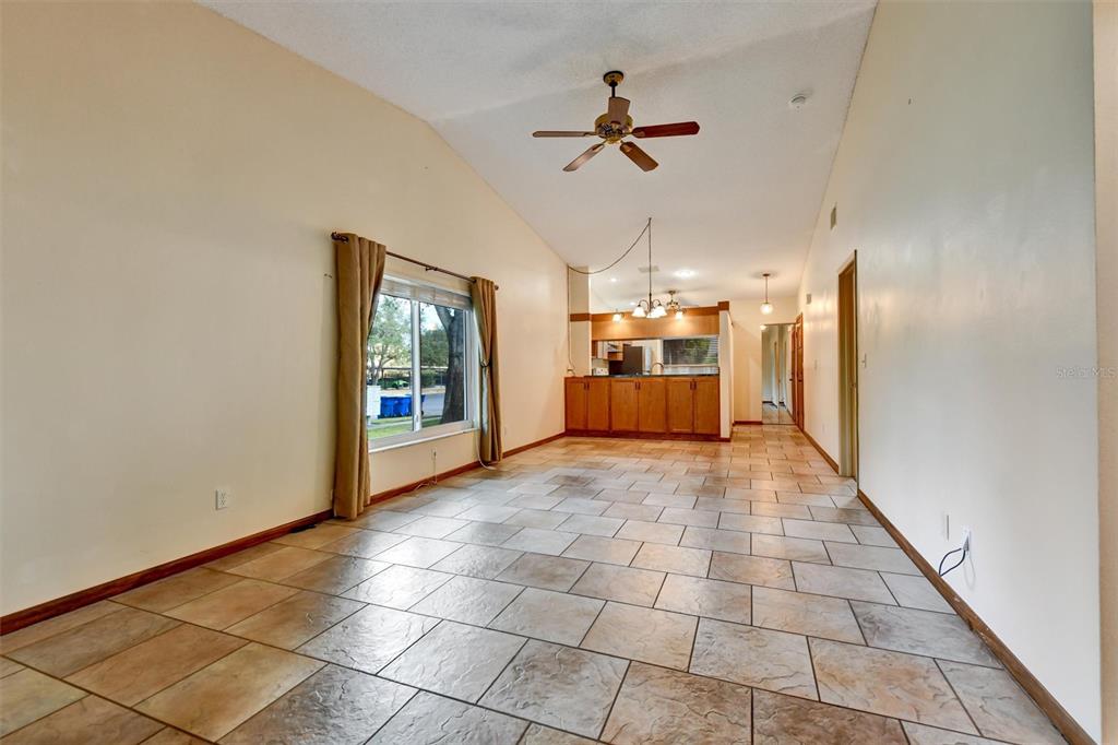 558 Capistrano Court Largo, FL 33771 - Photo 4 of 40 a view of empty room with a kitchen