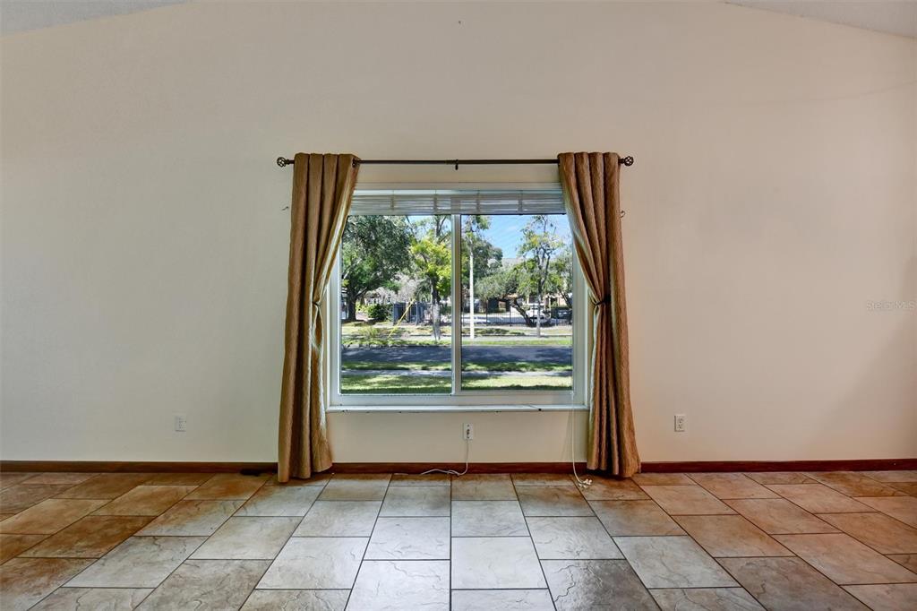 558 Capistrano Court Largo, FL 33771 - Photo 6 of 40 a view of an empty room with a window
