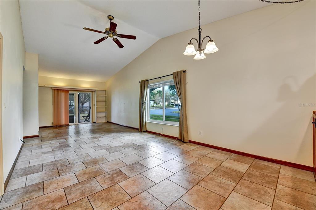 558 Capistrano Court Largo, FL 33771 - Photo 8 of 40 a view of empty room with wooden floor