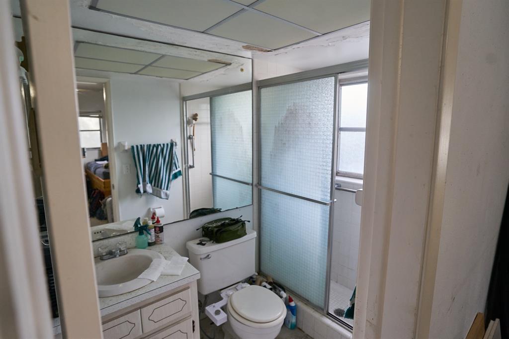 651 Pine Drive, Unit 201 Pompano Beach, FL 33060 - Photo 13 of 18 a bathroom with a toilet and a shower