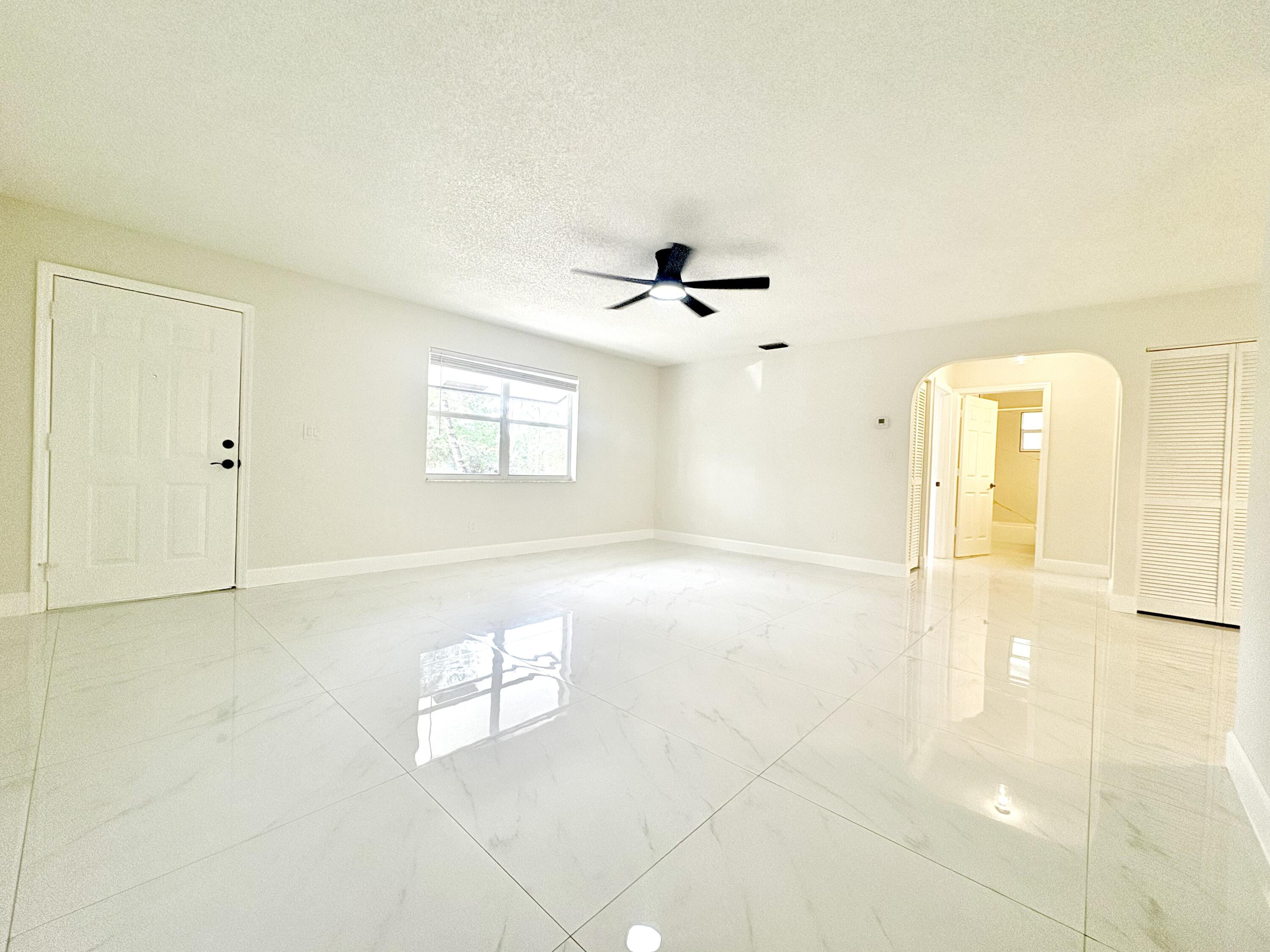 14523 Flamingo Road Loxahatchee Groves, FL 33470 - Photo 6 of 50 a view of an empty room with a window