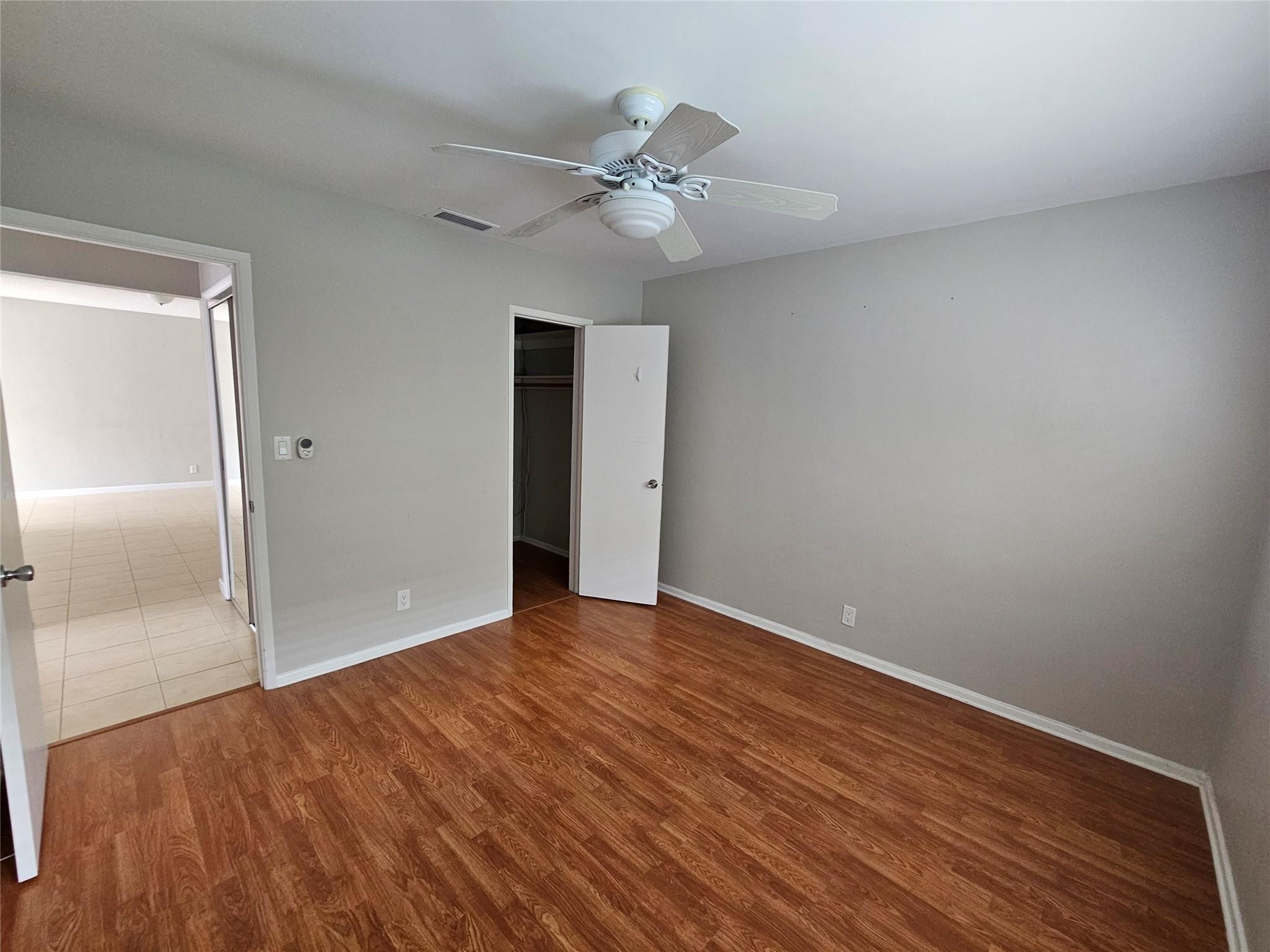 2120 Northeast 41st Street, Unit B Lighthouse Point, FL 33064 - Photo 14 of 24 a view of an empty room with wooden floor