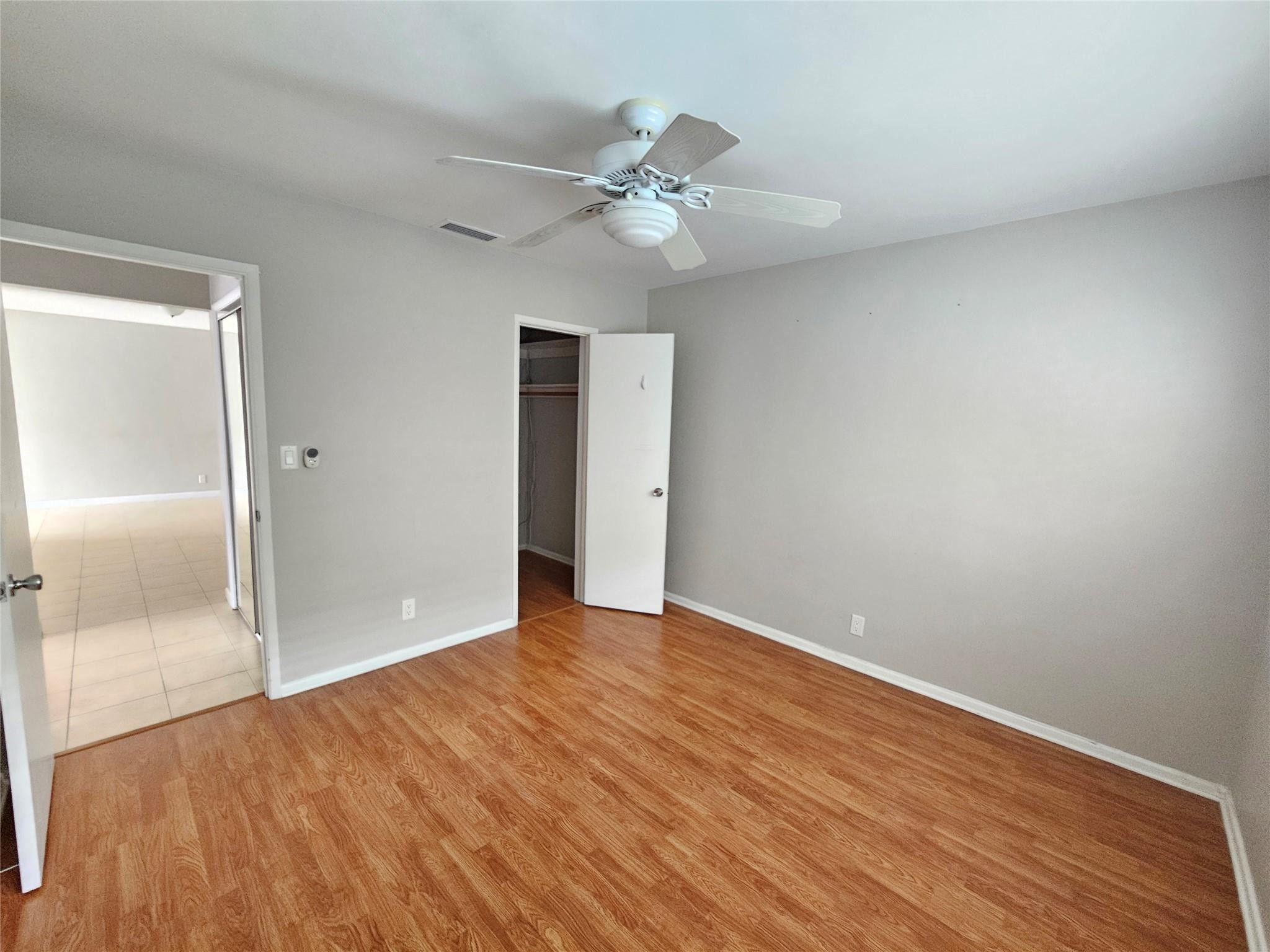 2120 Northeast 41st Street, Unit B Lighthouse Point, FL 33064 - Photo 15 of 24 a view of an empty room with wooden floor