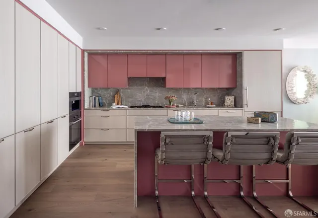 a kitchen with a sink cabinets and window