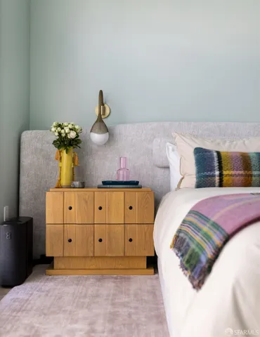 a bedroom with a bed and a dresser