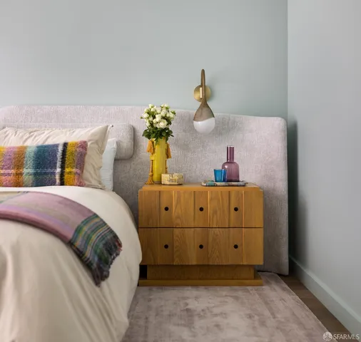 a bedroom with a bed and a dresser