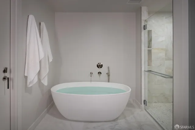 a white bath tub sitting in a bathroom