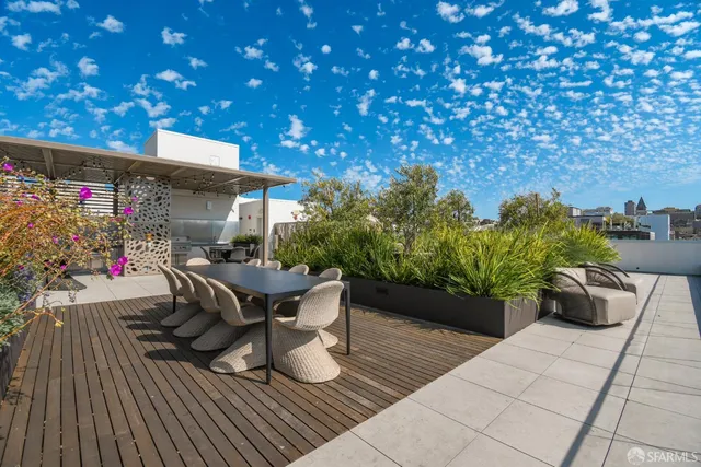 a view of a chairs and table in the patio