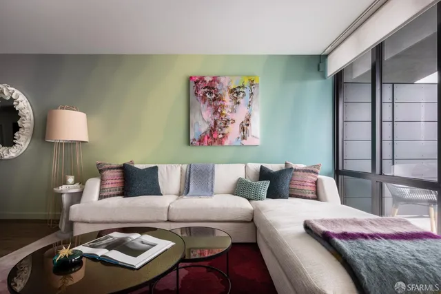 a living room with furniture and a lamp