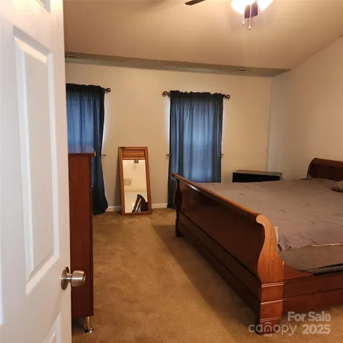 a bed room with a bed and a dresser