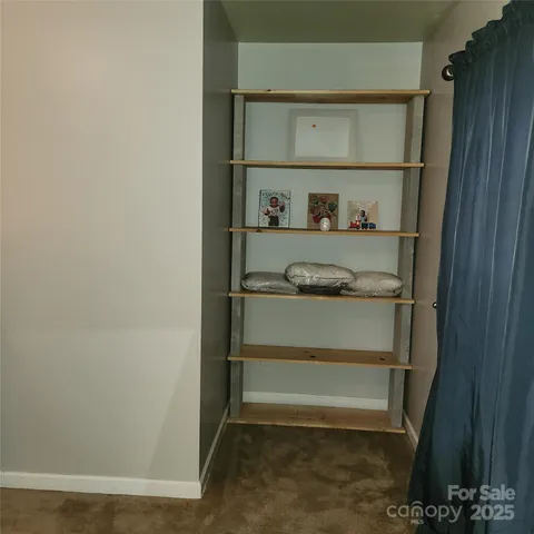 a view of an empty walk in closet
