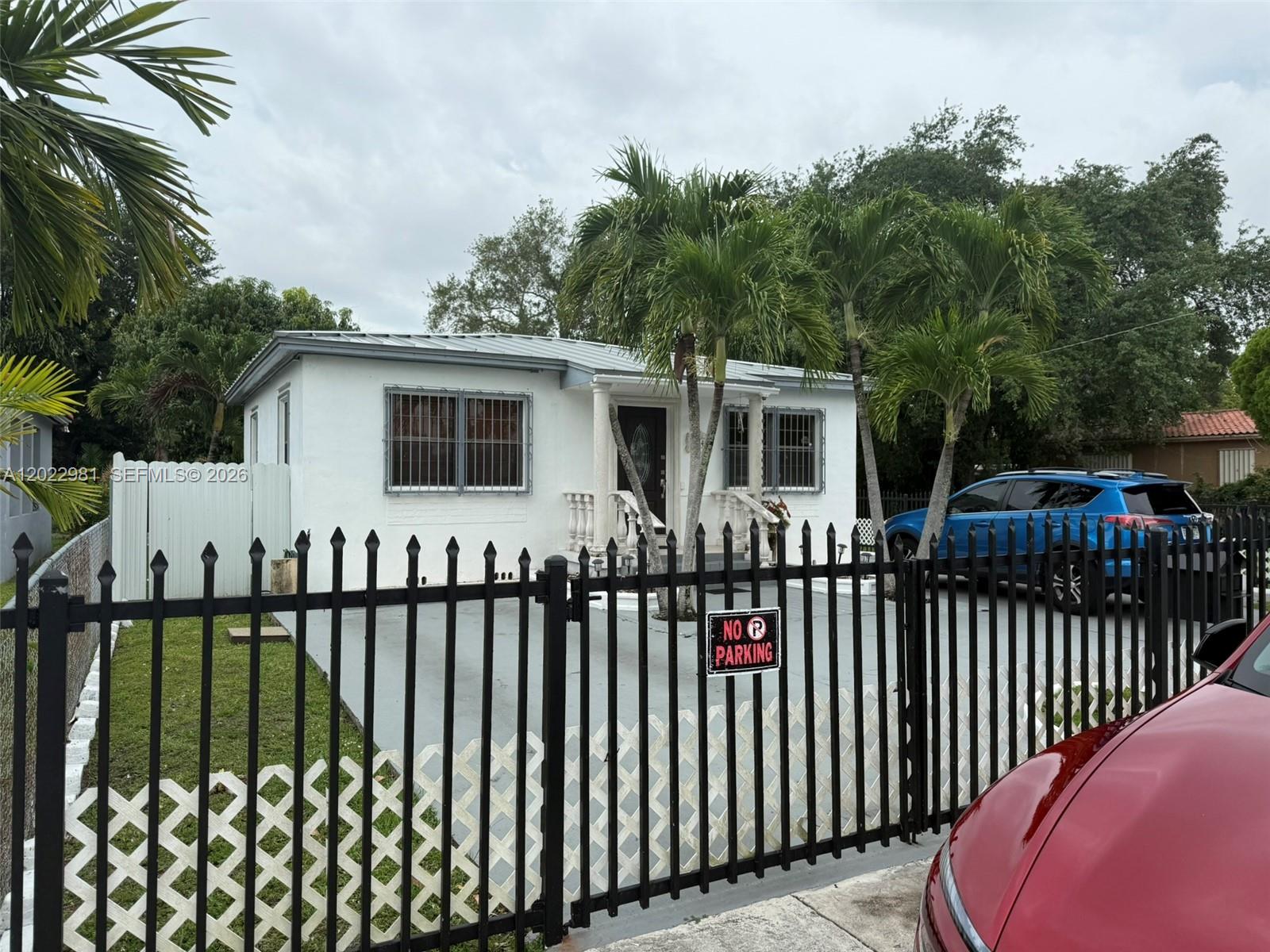 5940 Southwest 2nd Street Miami, FL 33144 - Photo 6 of 22 a view of a house with wooden fence