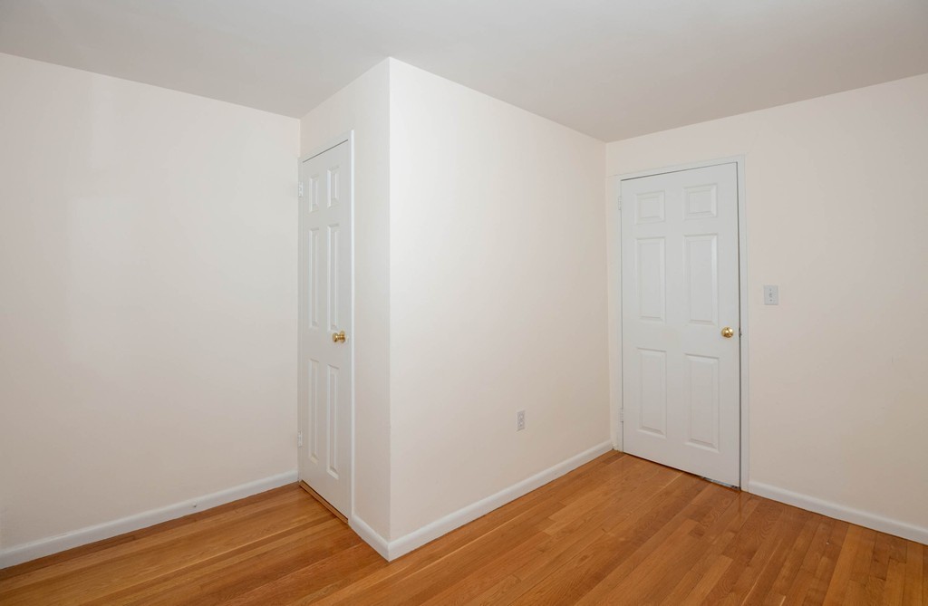 28 Charles Road, Unit 28 Winchester, MA 01890 - Photo 19 of 28 a view of an empty room with wooden floor