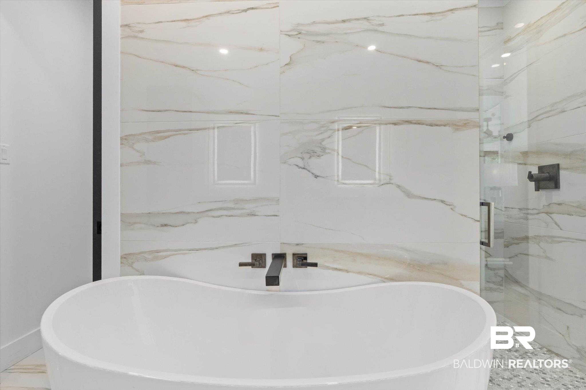 69 Jordan Lane Mobile, AL 36608 - Photo 22 of 57 Full bath featuring a freestanding tub and a marble finish shower