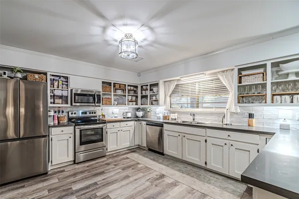 a bathroom with a sink a vanity and a mirror
