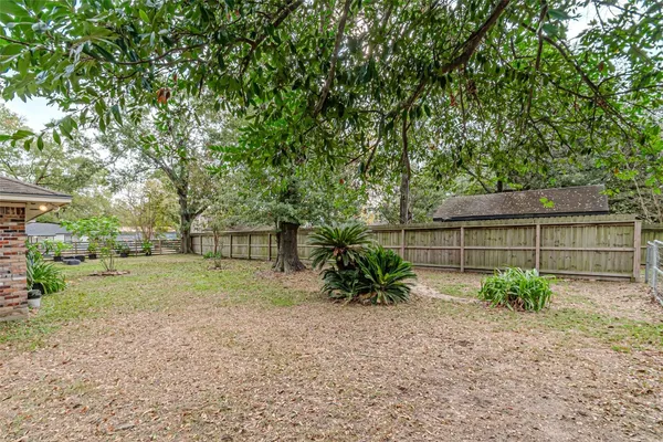 an empty room with furniture and a fireplace