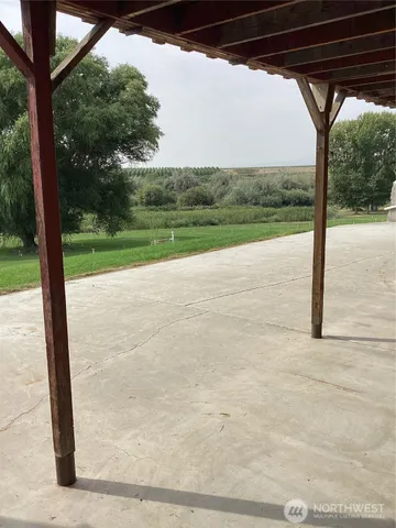 a view of a backyard of the house