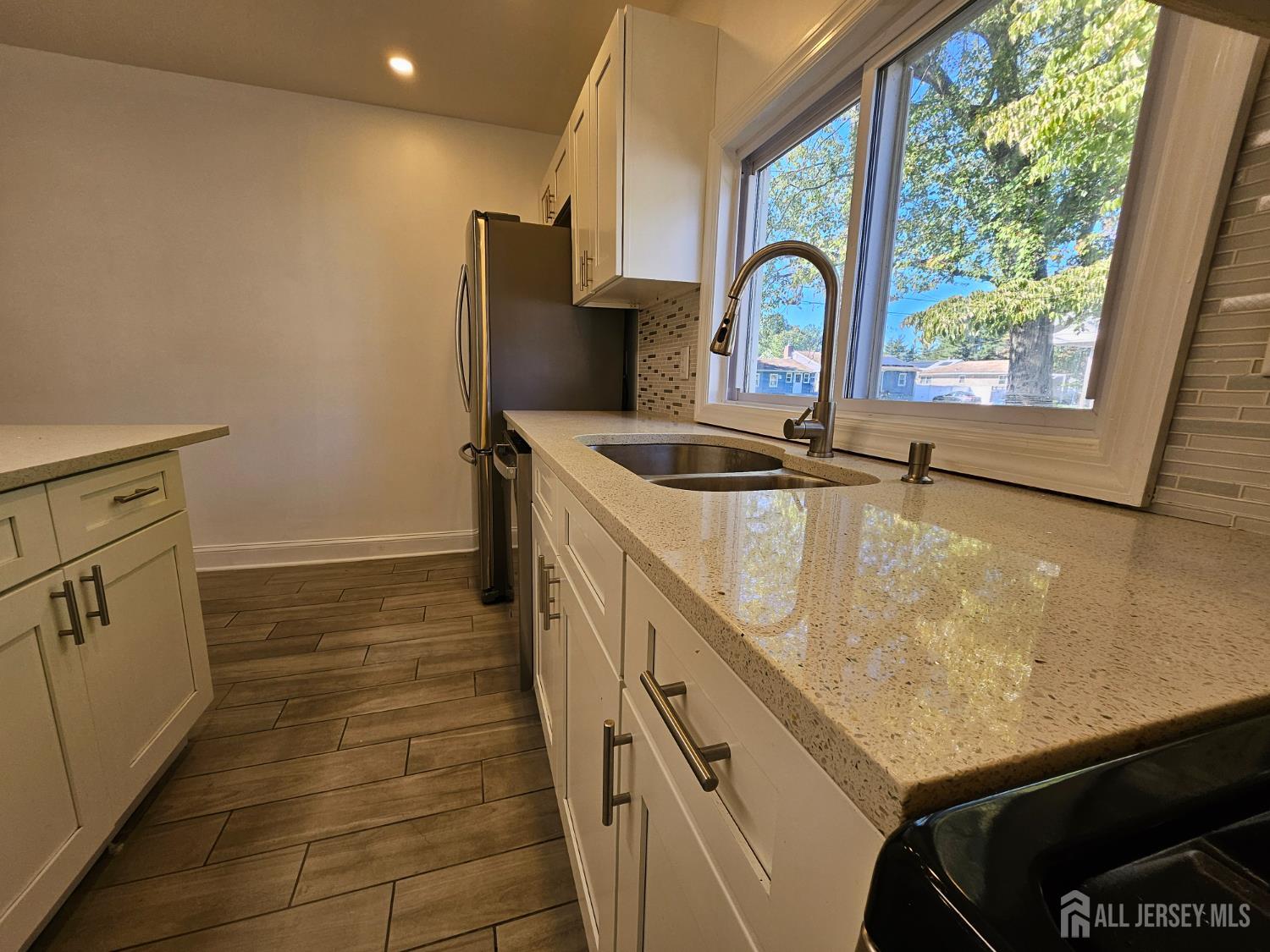 60 6th Avenue Trenton, NJ 08619 - Photo 18 of 28 a close view of sink and tap