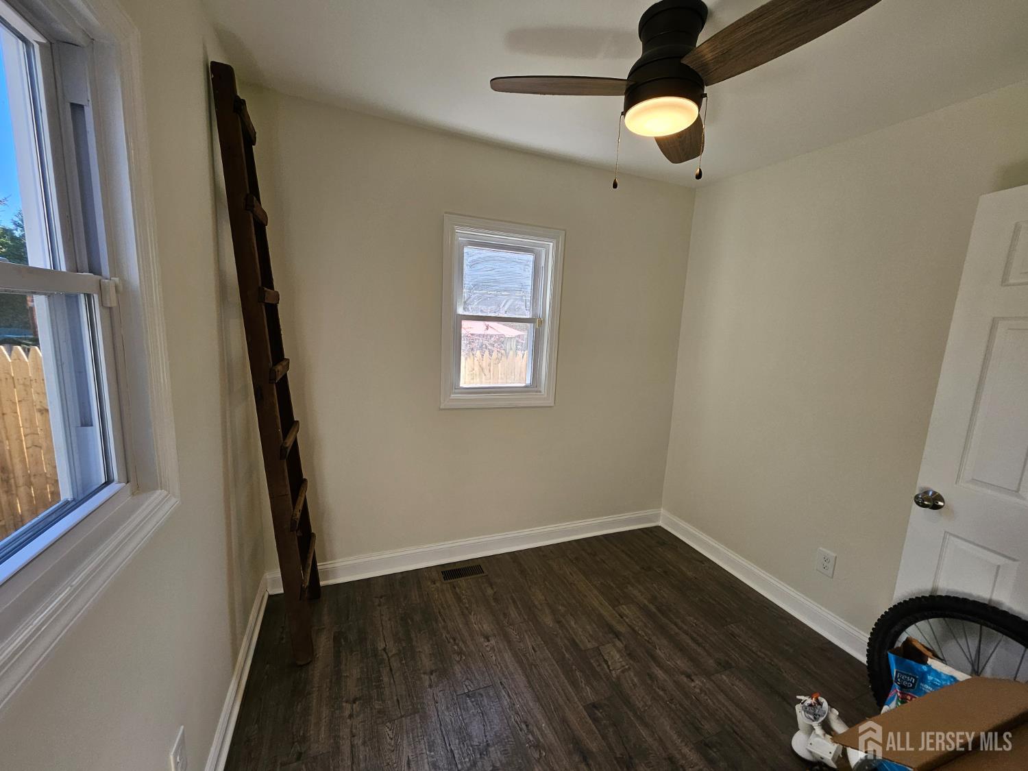 60 6th Avenue Trenton, NJ 08619 - Photo 22 of 28 wooden floor in an empty room with a window