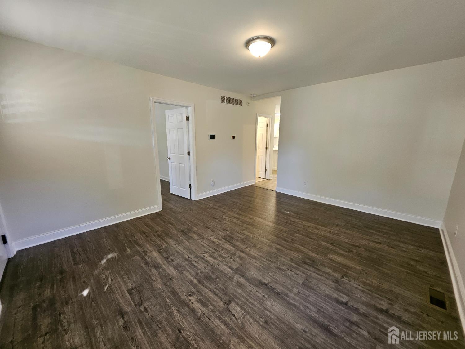 60 6th Avenue Trenton, NJ 08619 - Photo 7 of 28 wooden floor in an empty room