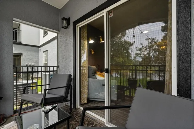 a balcony view with a glass door