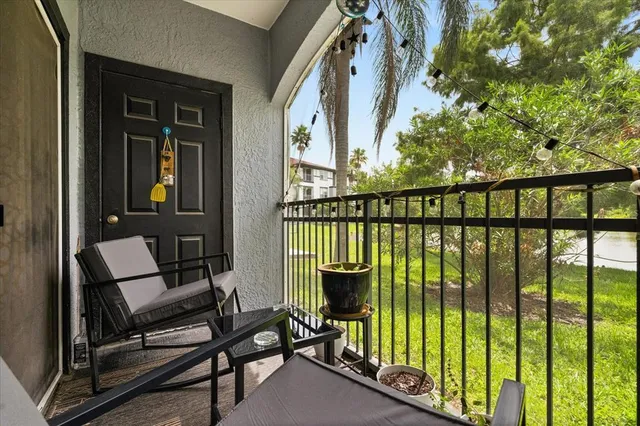 a view of a balcony with furniture