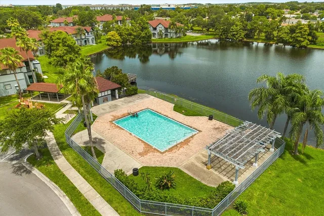 an aerial view of a house with a lake view