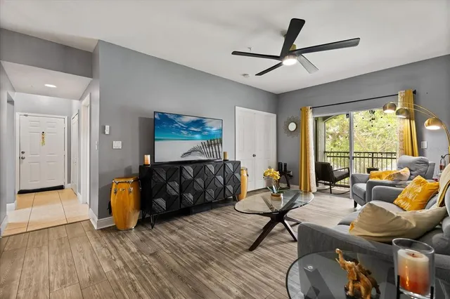 a living room with furniture and a large window