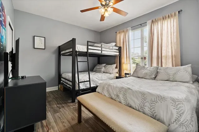 a bedroom with two beds and a dresser
