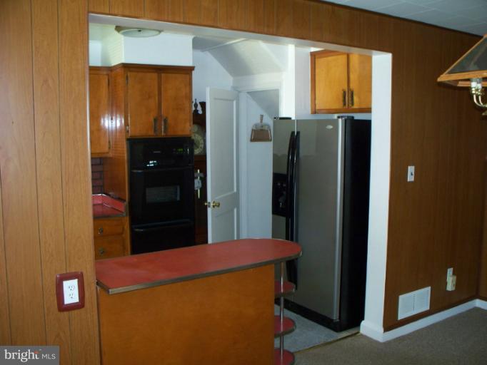 2234 Coralthorn Road Baltimore, MD 21220 - Photo 12 of 30 a kitchen with stainless steel appliances a refrigerator and a window