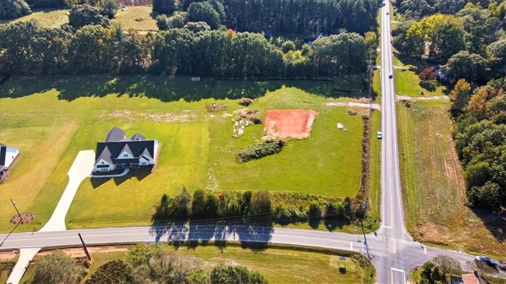 1217 Pleasant Valley Road Monroe, GA 30655 - Photo 1 of 8 a view of a swimming pool with a yard and plants