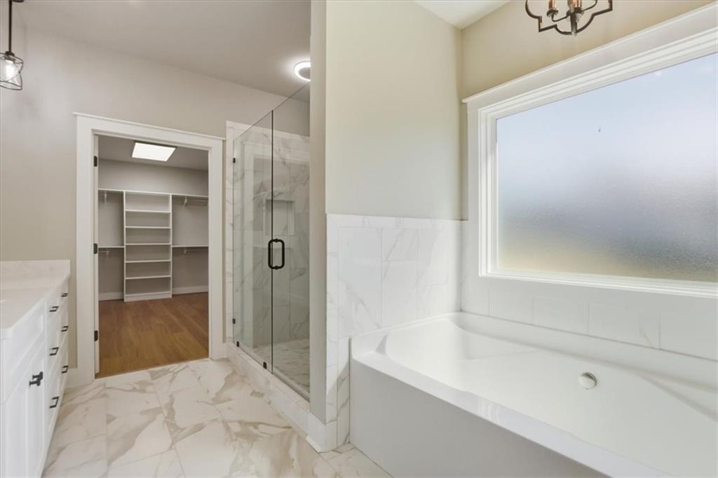 1217 Pleasant Valley Road Monroe, GA 30655 - Photo 7 of 8 a bathroom with a shower and a tub