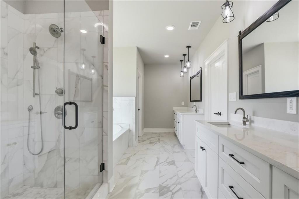 1217 Pleasant Valley Road Monroe, GA 30655 - Photo 8 of 8 a bathroom with a double vanity sink mirror and shower