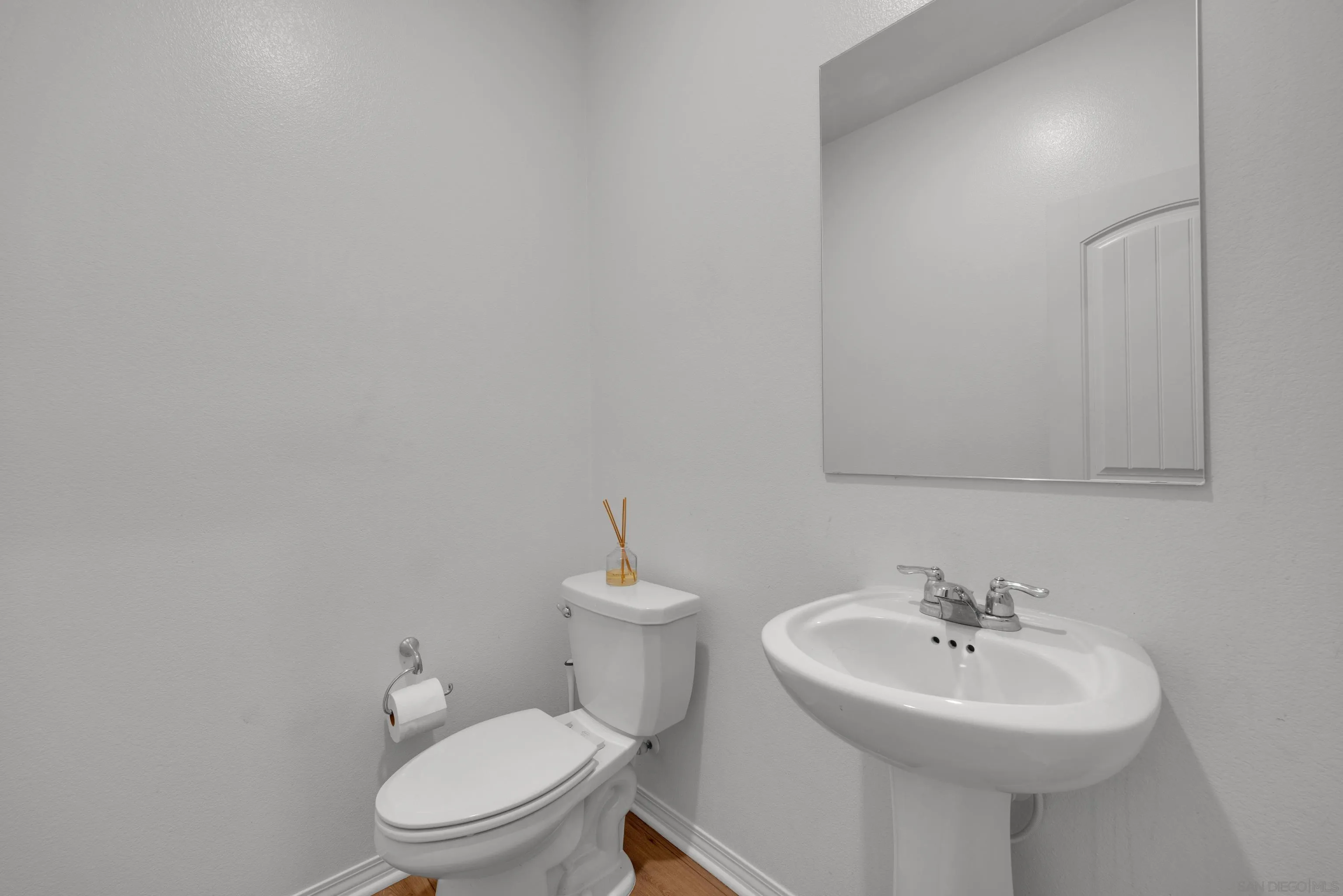 41984 Retsina Street, Unit 705 Murrieta, CA 92562 - Photo 11 of 39 a bathroom with a sink a toilet and mirror