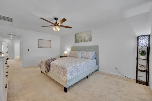 a bathroom with a sink a vanity and a large mirror