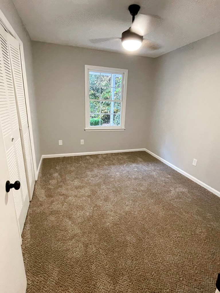 5 Randall Court Columbus, GA 31909 - Photo 15 of 18 an empty room with windows and fan