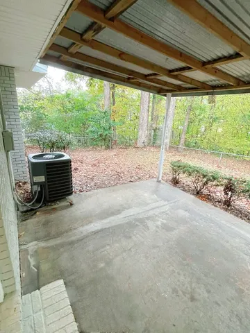 a view of a backyard with a garden and plants