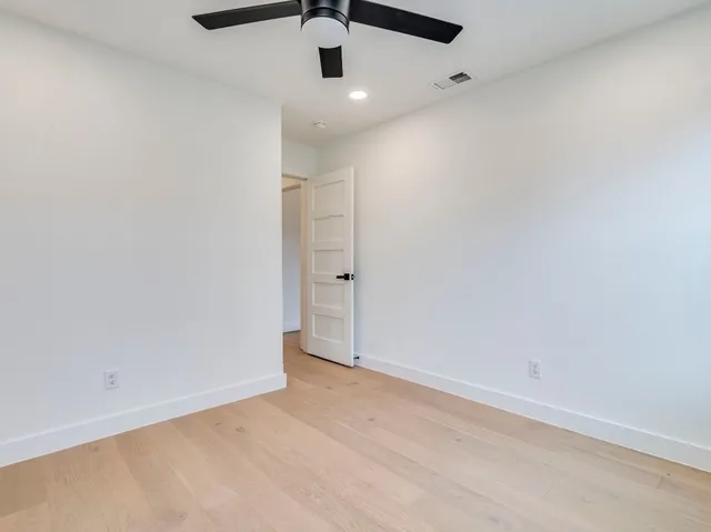 a bedroom with a large bed and a couch