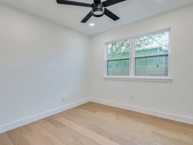 a bedroom with bed and window