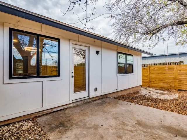 a view of a backyard of the house