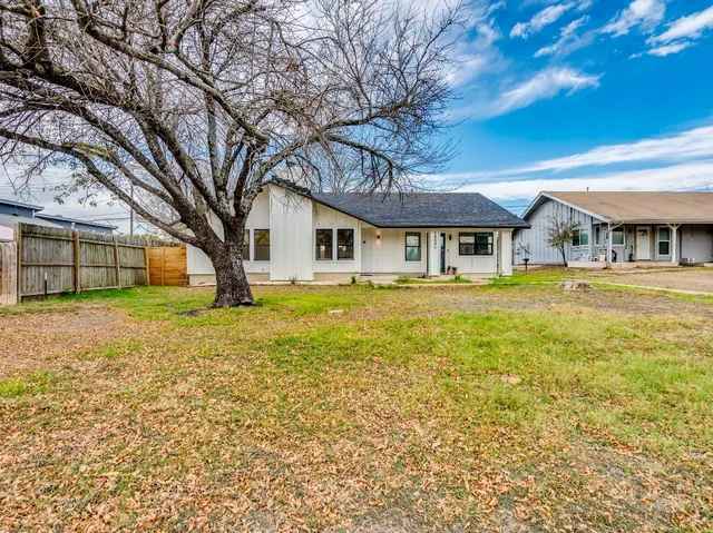 a house with swimming pool in front of it