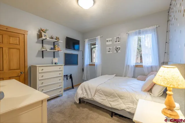 a bedroom with a bed and a cabinets