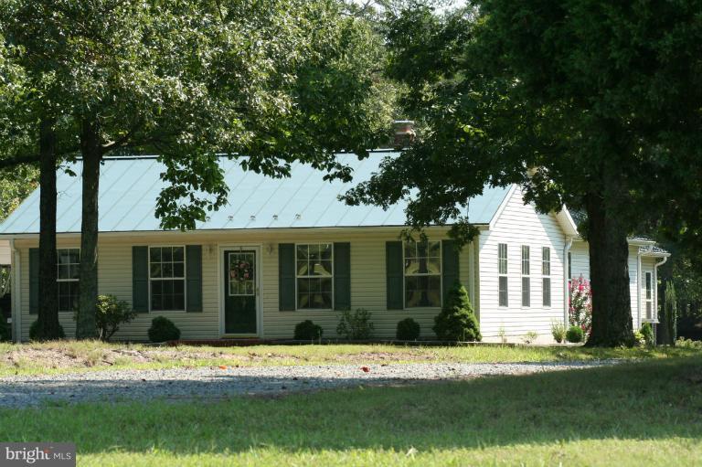 5169 Courtneys Corner Road Sumerduck, VA 22742 - Photo 1 of 29 a house that has a tree in front of it