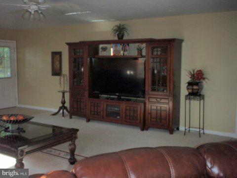 5169 Courtneys Corner Road Sumerduck, VA 22742 - Photo 14 of 29 a living room with furniture and a flat screen tv